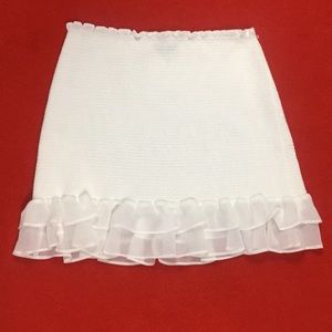 smocked white mini skirt with ruffles.